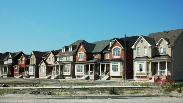 Row of houses in a subdivision with a blue sky