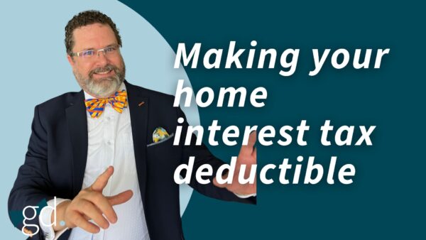 Man in a bow tie, with glasses and beard in a blazer