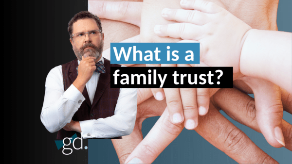 Man in beard and bow tie next to hands in a pile with the text what is a family trust?