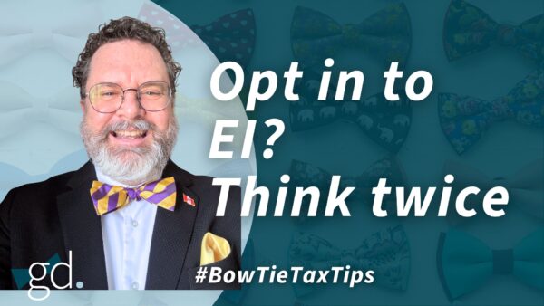 White male with short dark hair, a whitish beard, glasses and a easter coloured bow time with a blue shirt and blue jacket talking about EI for business owners in Canada