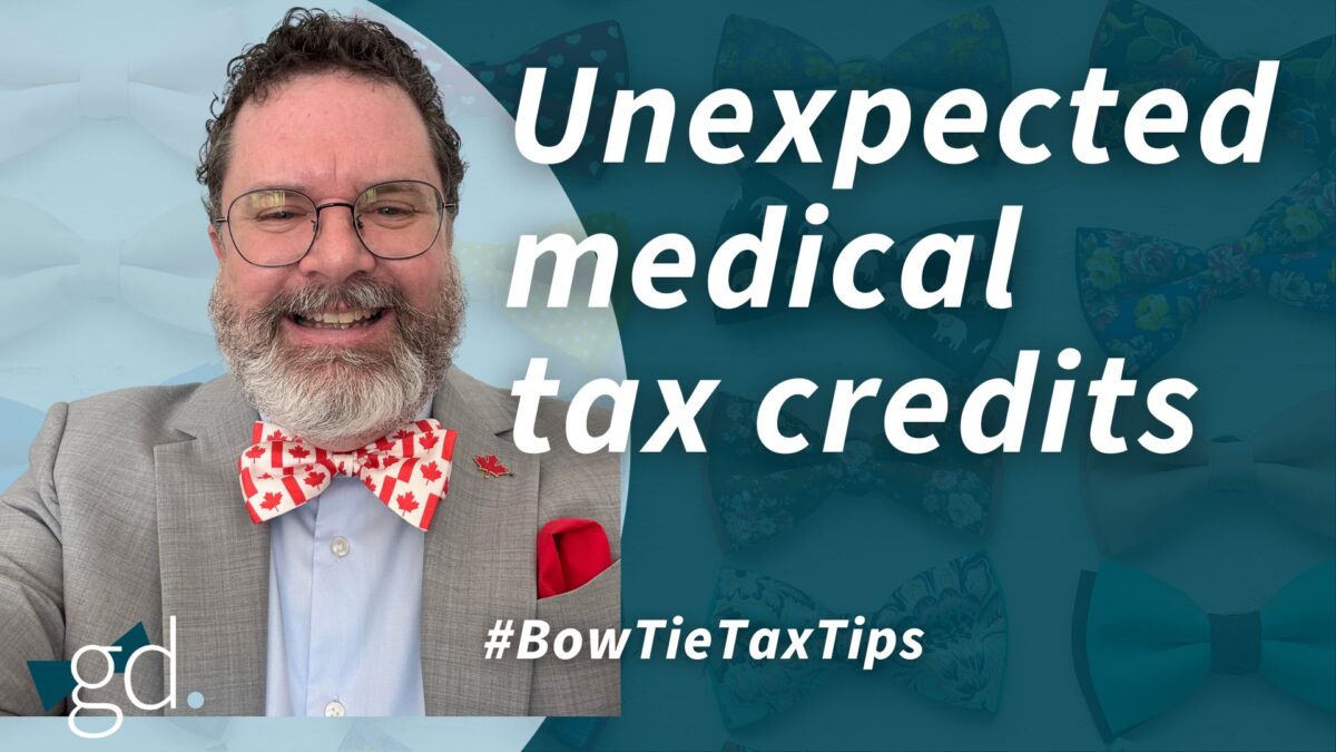 White male with dark, curly hair and a whitish beard and glasses wearing a gray suit jacket with light blue shirt and Canada bow tie, talking about claiming medical expenses