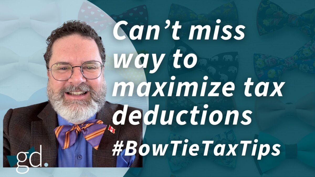 White male, dark curly hair, whitish beard, wearing glasses, a dark suit jacket, blue shirt and pink and blue bow tie talking about "maximizing your tax deductions"