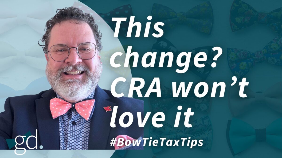 Man with glasses and curly dark hair that is short with a whitish beard, wearing a pink polka dot and blue tie with blue shirt and dark jacket talking about adjusting your tax return in Canada